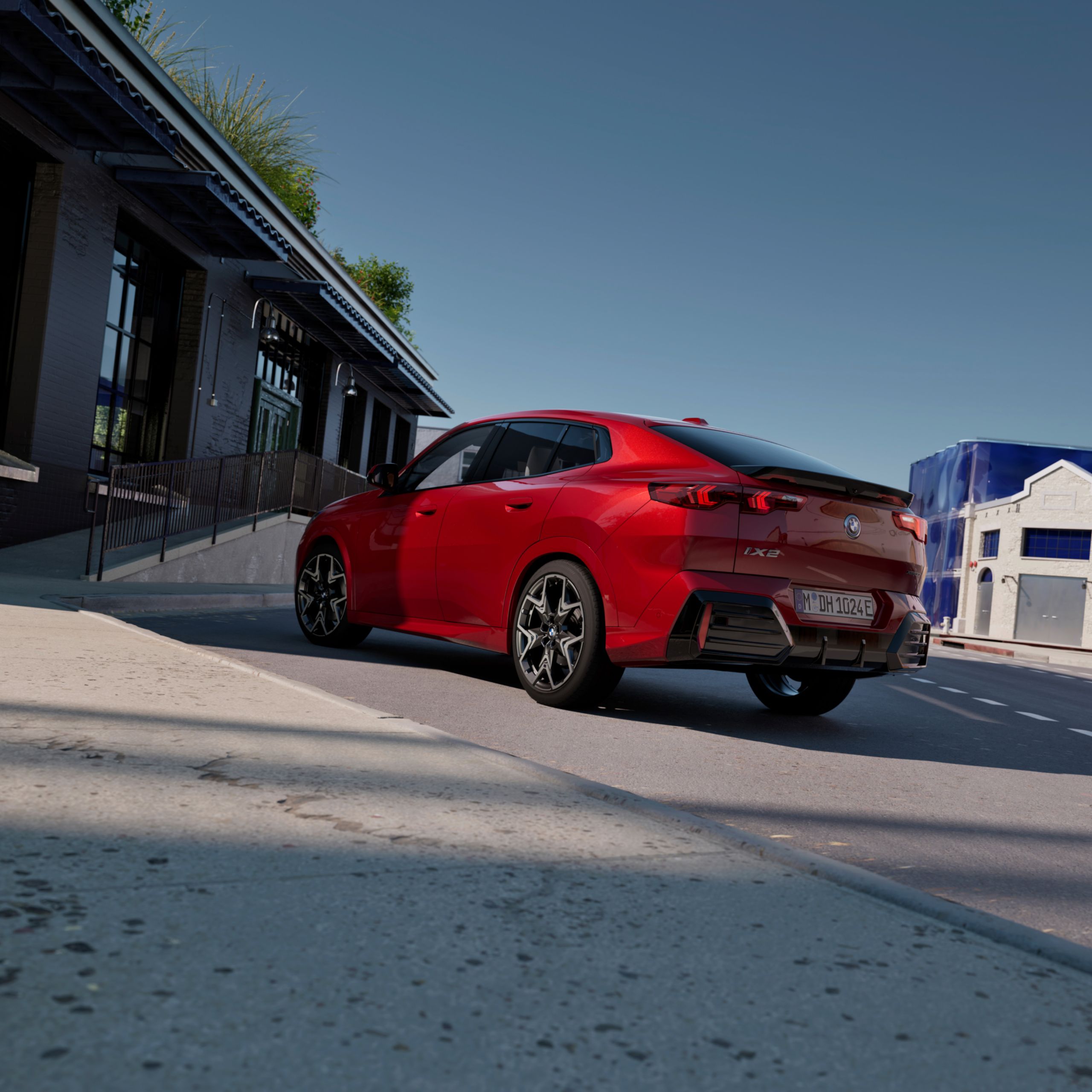 Video loop of the exterior view of the BMW iX2 xDrive30 in Dragonfire Red with light alloy wheels 