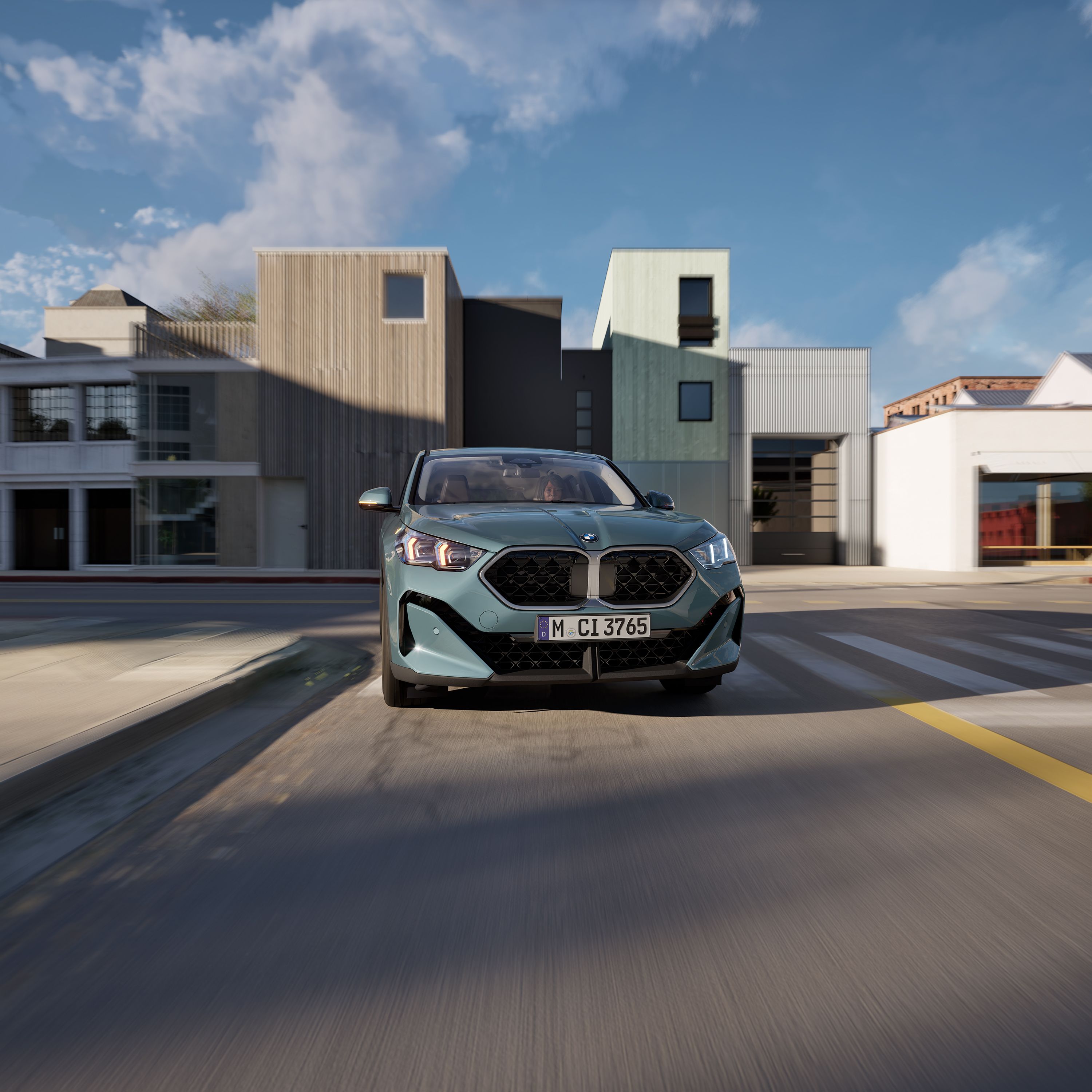 BMW X2 sDrive 20i exterior low angle shot front right, showcasing the car with light alloy wheels and lights engaged