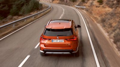 BMW X1 orange rear view 