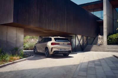 BMW X3 M50 xDrive white rear view 