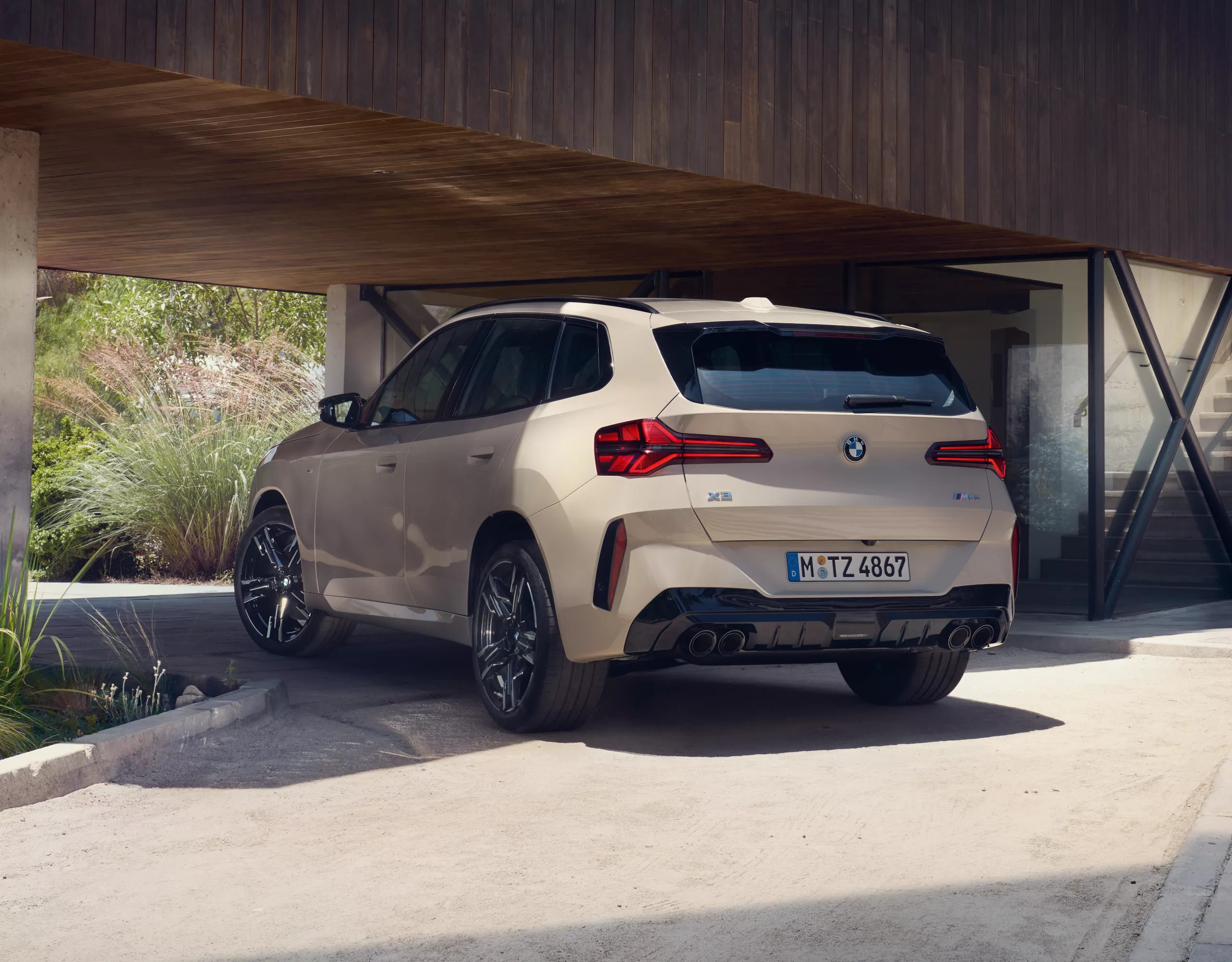 BMW X3 M50 xDrive white rear view 