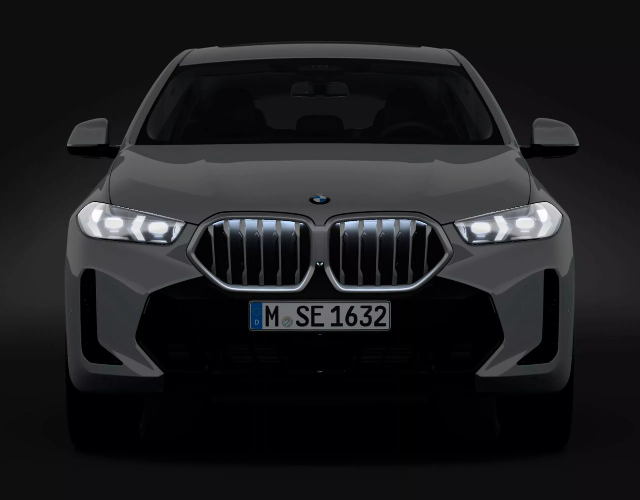 Um BMW X6 SUV com pacote M Sport Pro está estacionado em frente à porta de um hangar