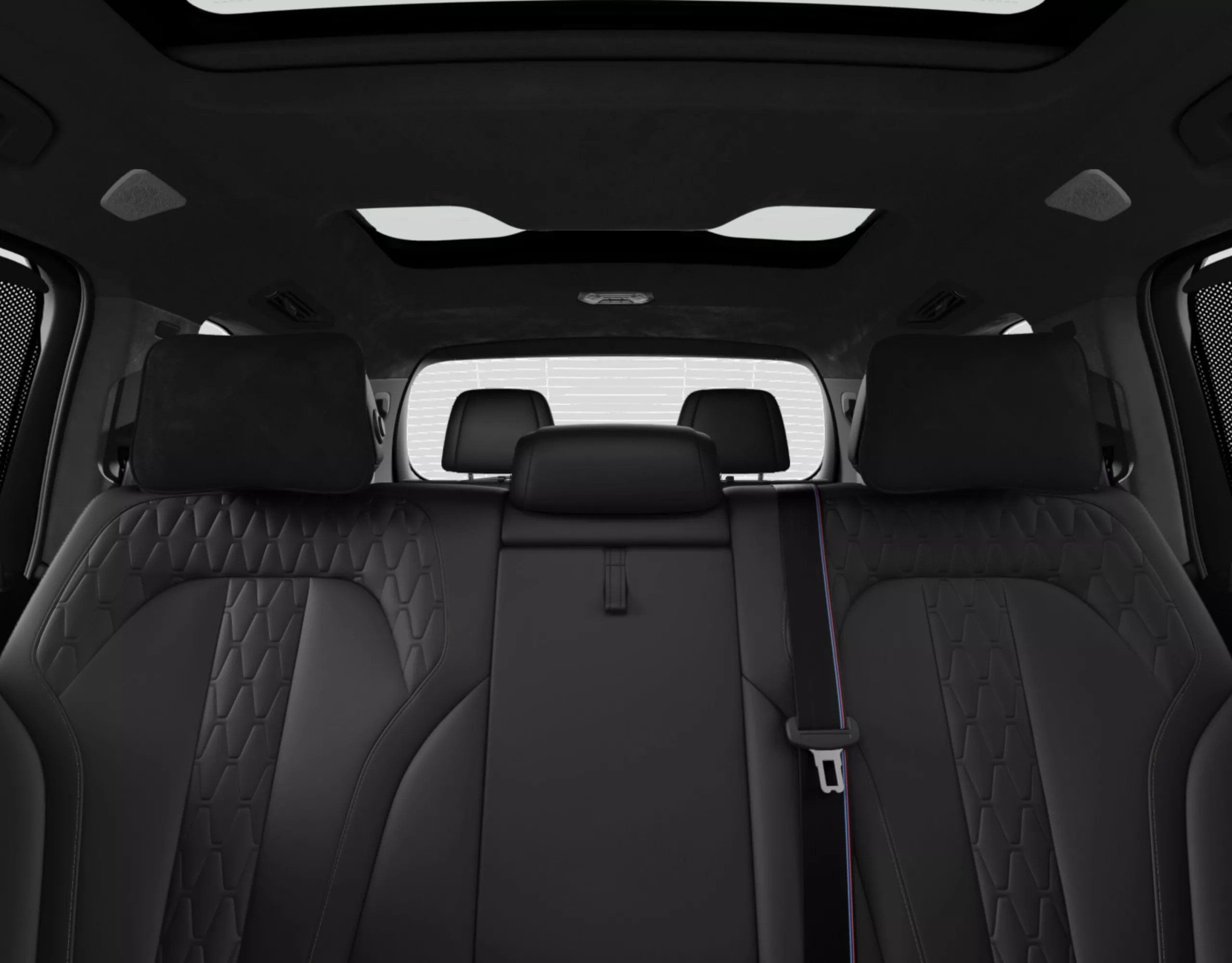 Configuração de assentos individuais em um BMW X7 com assentos dobrados e movidos nas fileiras traseiras de assentos.