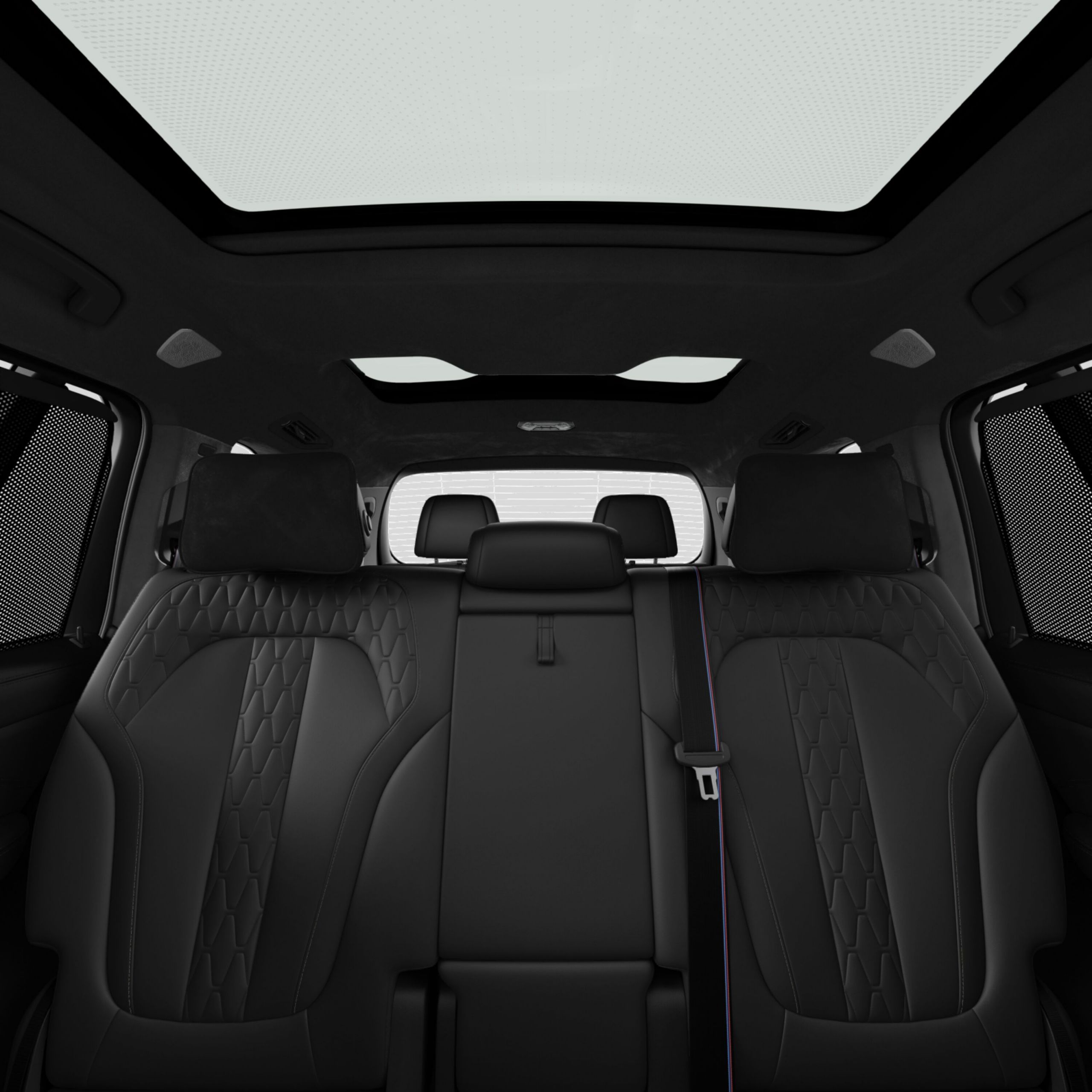 Configuração de assentos individuais em um BMW X7 com assentos dobrados e movidos nas fileiras traseiras de assentos.